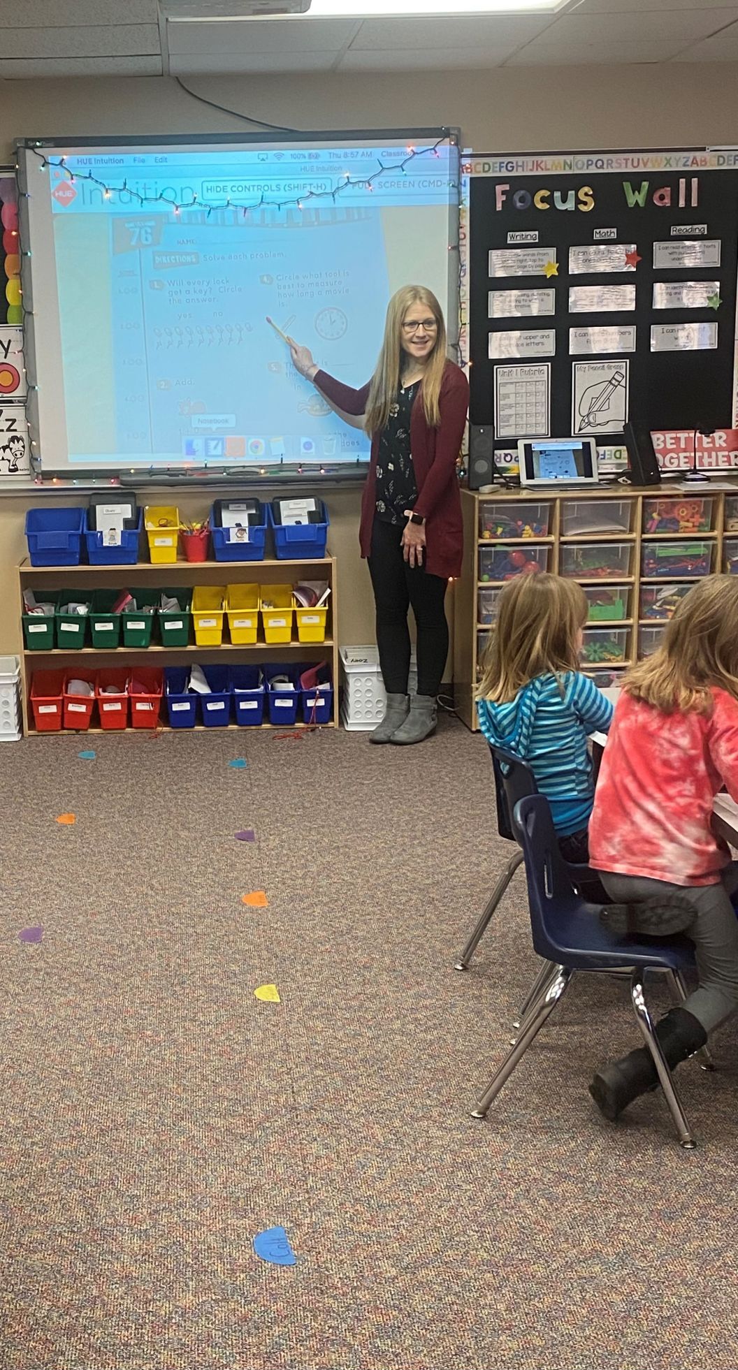 Amanda Geelan helps Kindergarten students learn to read at Forest City Elementary School..jpg